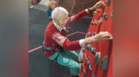 Greta on a climbing wall
