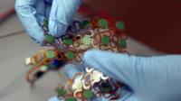 A person holding e-skin sensors