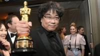 Bong Joon-ho holds his Oscar