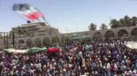 Crowds of people gather outside the army's headquarters in Khartoum