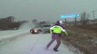 Sliding car narrowly misses US police officer