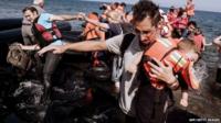 Refugees and migrants arrive on Eftalou beach, west of the port of Mytilene, on the Greek island of Lesbos