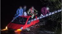 The water came up over the bumper of their car, which cut the electrics