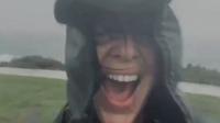 Woman laughing in the rain