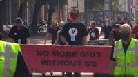 Banner in Manchester march reading: No More Gigs Without Us