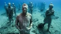 Figures from the underwater museum exhibit