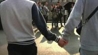 Gay couple holding hands