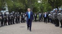 President Trump walks out of White House