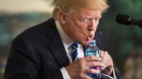The president goes in search of water during a speech, prompting comparisons with a man he mocked.