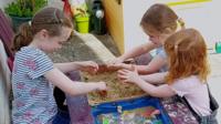 Children play in a sandpit