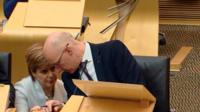 Nicola Sturgeon talks to John Swinney