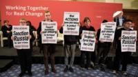 Protesters calling for aid drops in Syria and sanctions against Russia interrupt a speech by Labour Leader Jeremy Corbyn at the Methodist Central Hall in Westminster