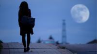Young woman walking home alone