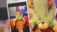 Screen grab of person using mobile phone