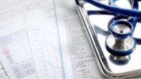 Stethoscope and paperwork