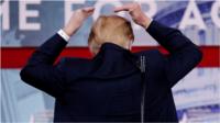 Donald Trump points at the "bald spot" he says he tries to hide