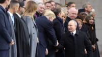 President Trump and President Putin shake hands