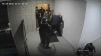 Robert Johnson being tackled to the ground by police