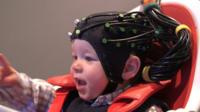 Baby with sensor cap