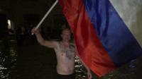 Man holding russian flag