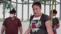 Woman in Ecuador waiting for her relative's body