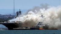 Smoke billowing from the USS Bonhomme Richard