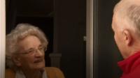 Woman talking to postie
