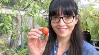Ellen Mary holding a tomato