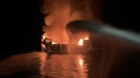 Boat on fire in the water