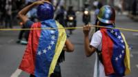 Opposition sympathizers participate in a protest in Caracas, Venezuela, 18 July 2017.