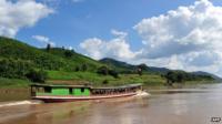 Mekong river boat in northern Laos, near the Thai border