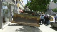 Bulldozer outside bank