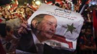 Egyptians gather outside the presidential palace to celebrate former Egyptian army chief Abdel Fattah al-Sisi"s victory in the presidential vote in Cairo
