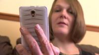 Mother looking at phone app