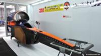 Parts of the car are even now being painted in the team's blue and orange livery