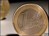 A one euro coin is pictured with a pound coin