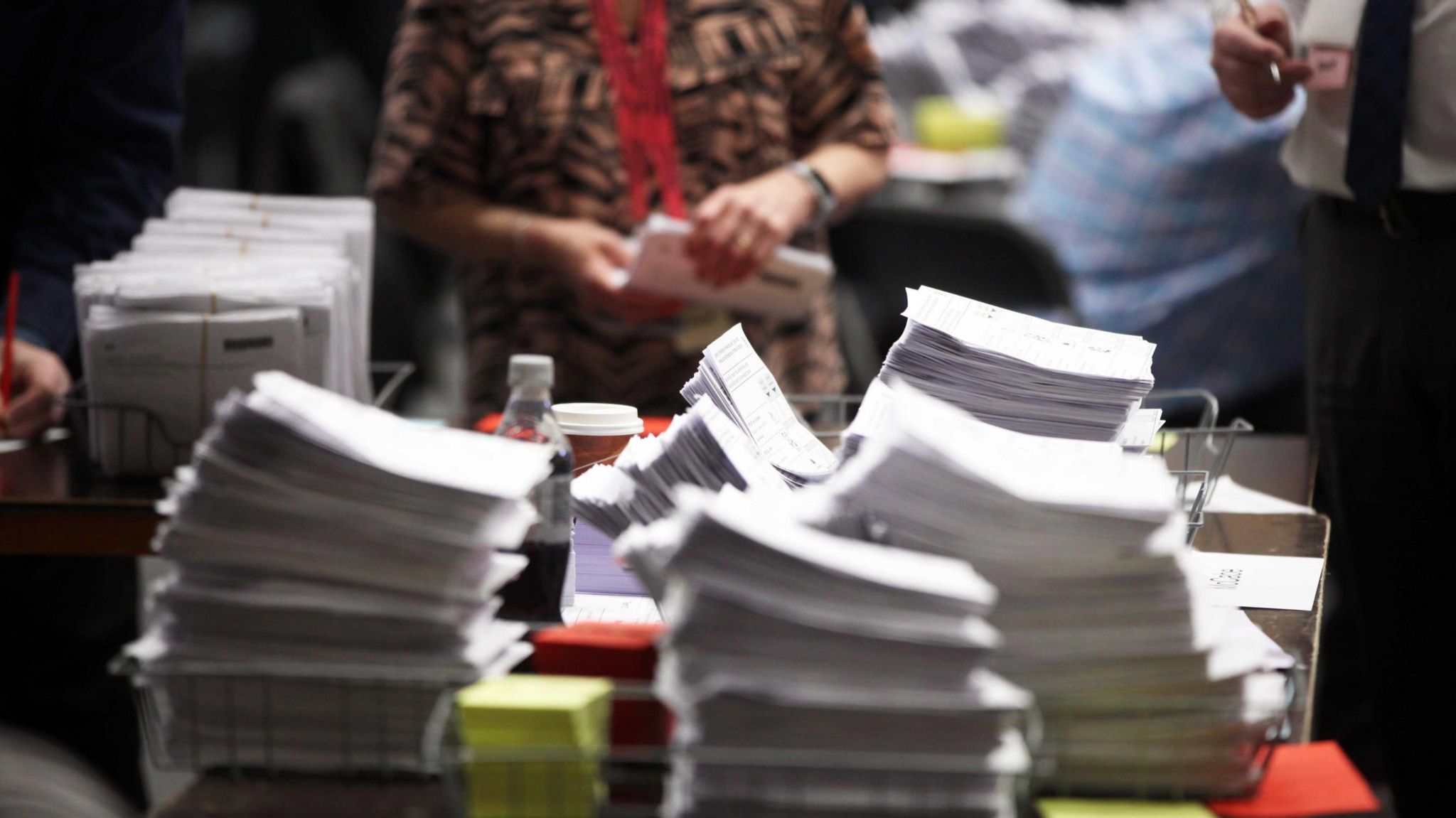 Piles of ballot papers to be counted