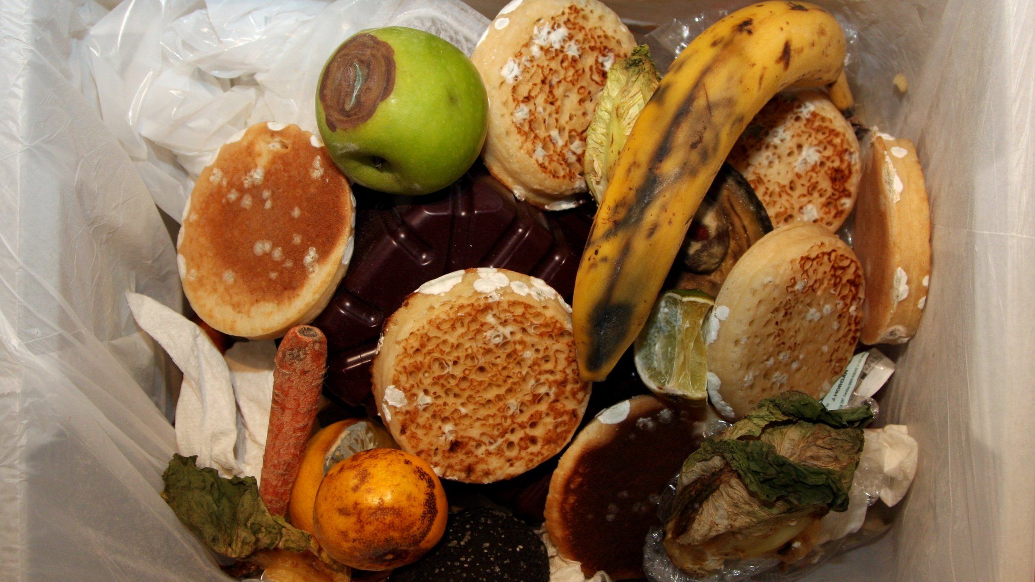 Food in a waste bin (Image: BBC)