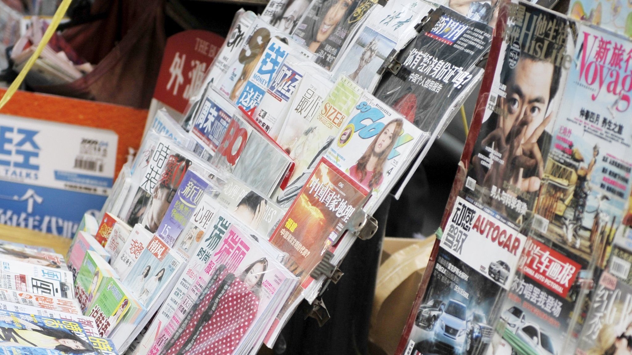 Various newspapers and magazines are seen at a roadside stall in Beijing on April 7, 2009