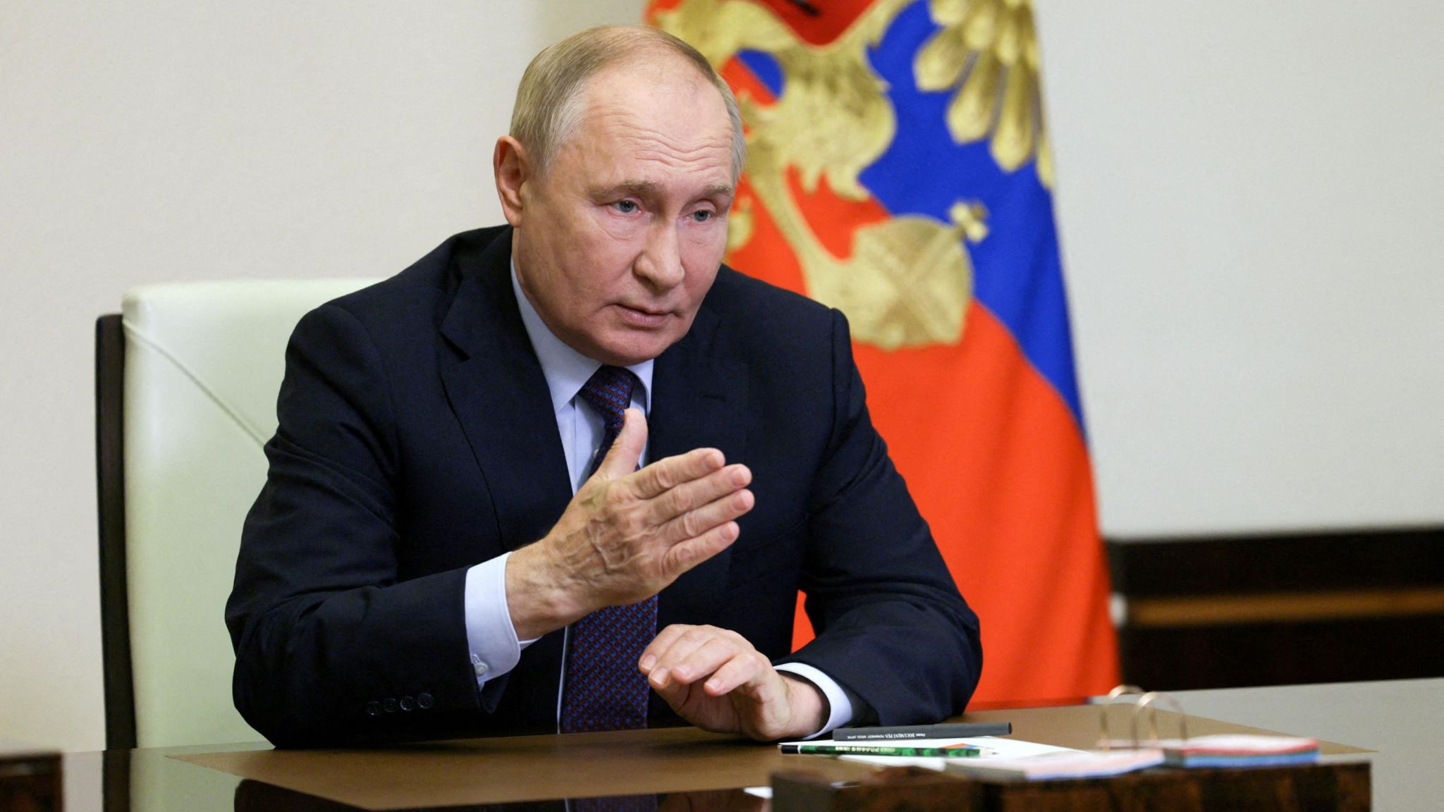 Russian President Vladimir Putin chairs a meeting with members of the Security Council 