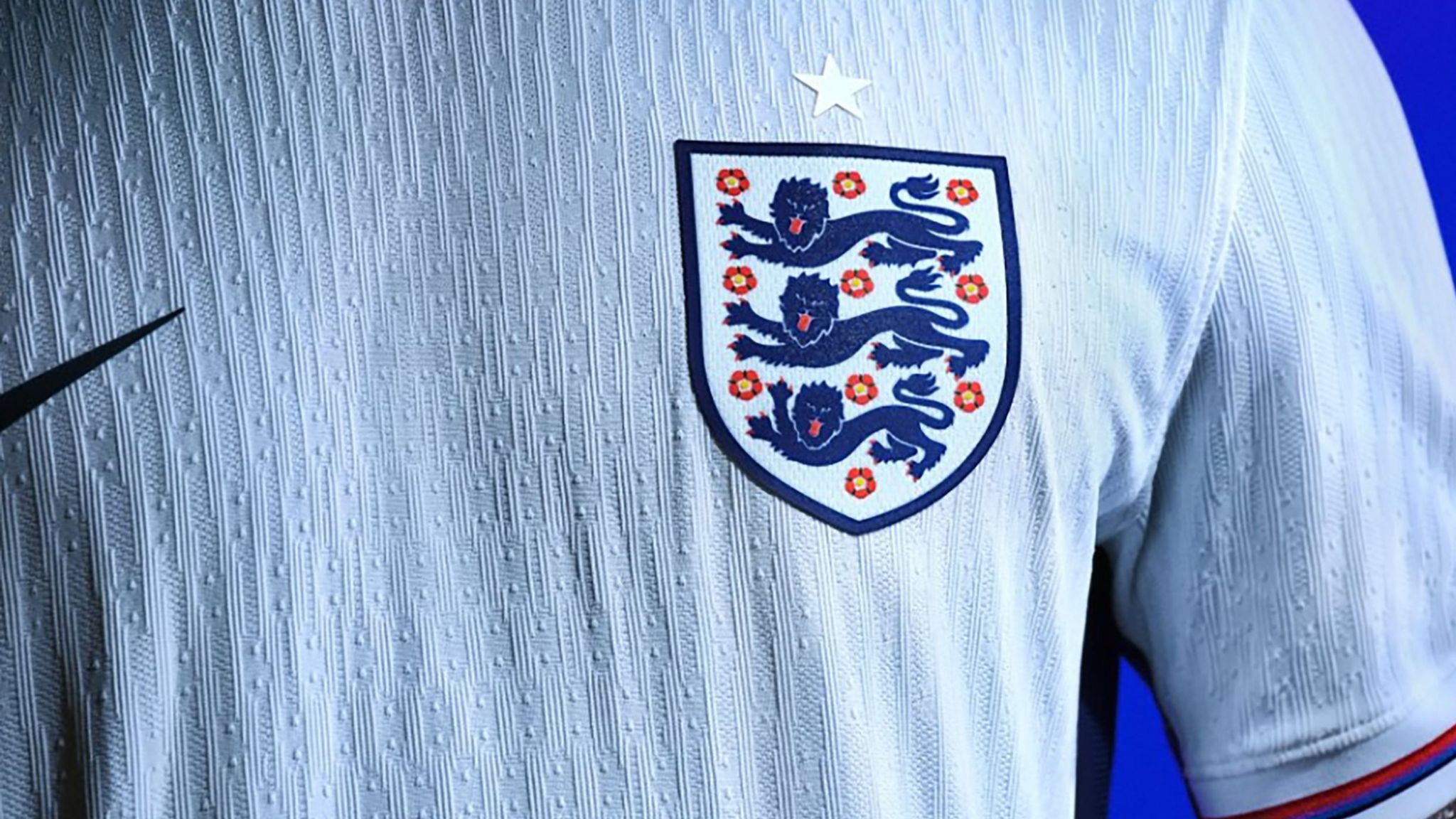 England's three lions badge on shirt