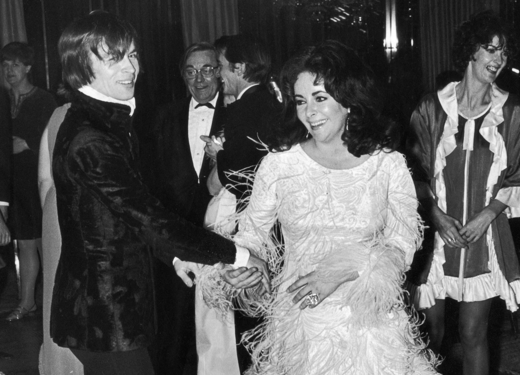 Rudolf Nureyev dancing with Elizabeth Taylor at a party in 1968