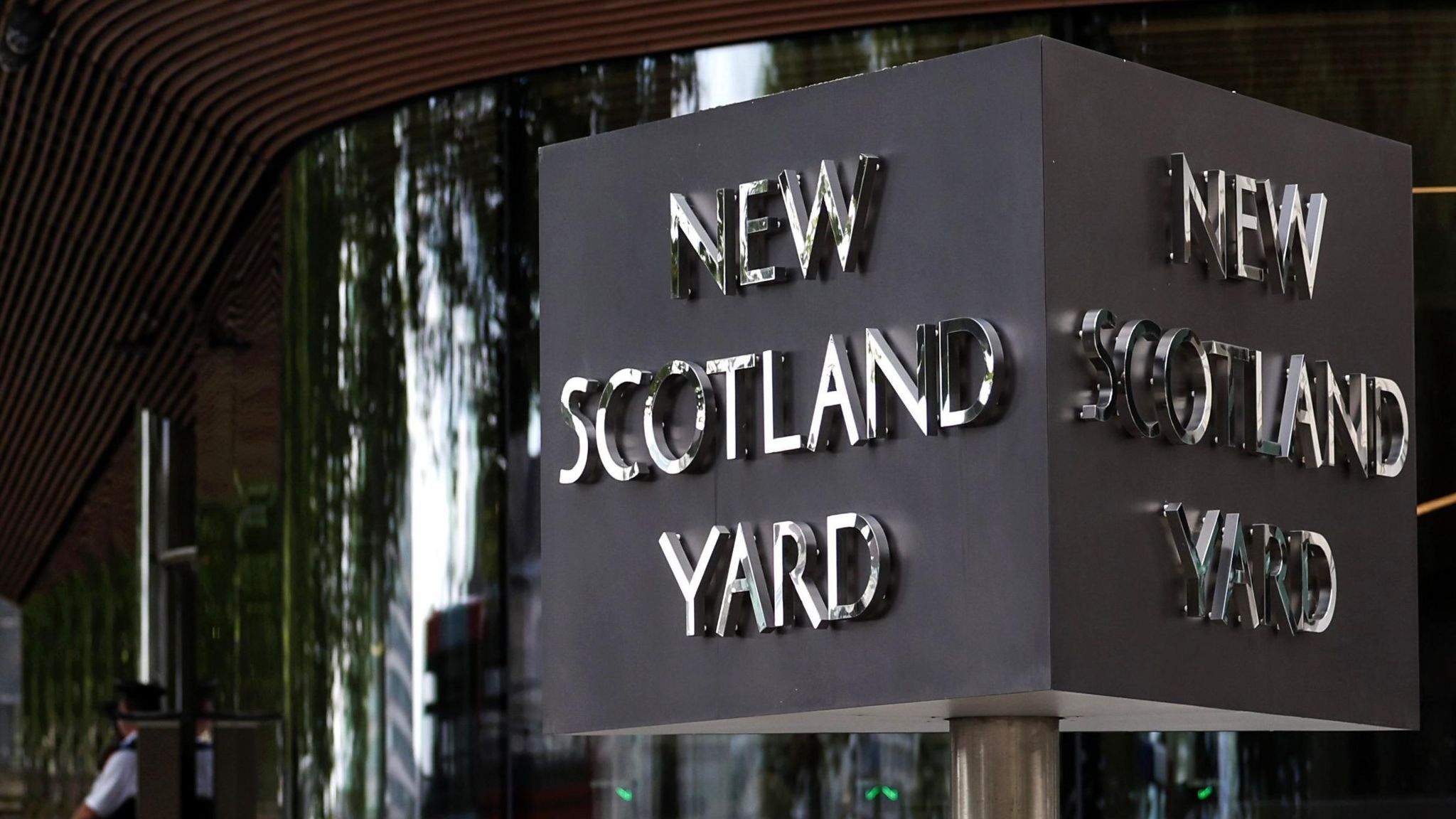 The New Scotland Yard sign outside Met police headquarters in London 