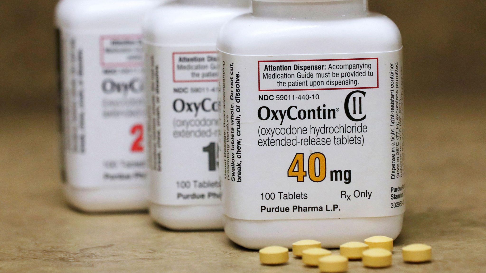 Bottles of prescription painkiller OxyContin pills, made by Purdue Pharma LP sit on a counter at a local pharmacy in Provo, Utah, U.S., April 25, 2017. 