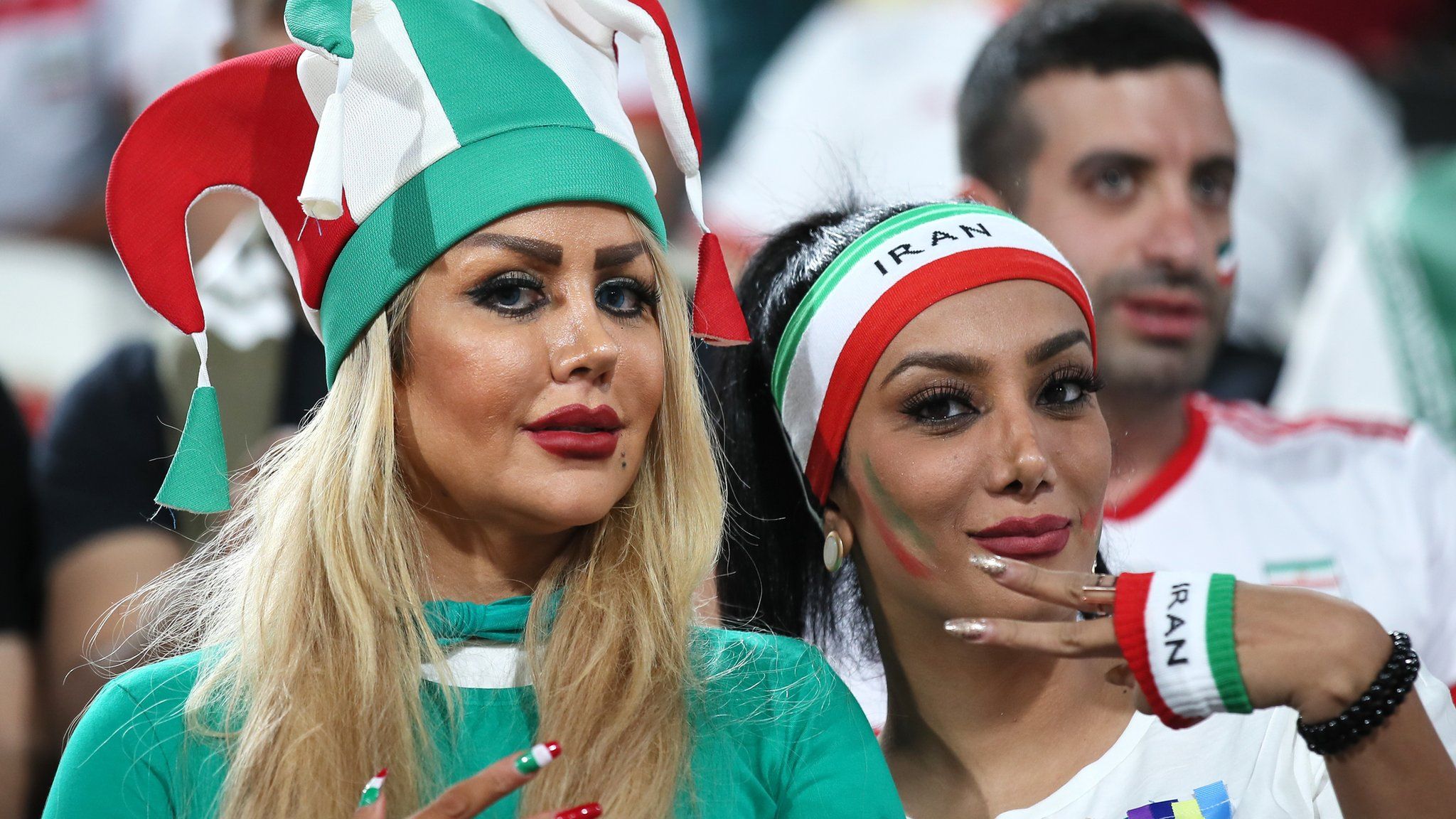 Female Iranian football fans attend a an AFC Asian Cup quarter-final between China and Iran in January 2019 in Abu Dhabi