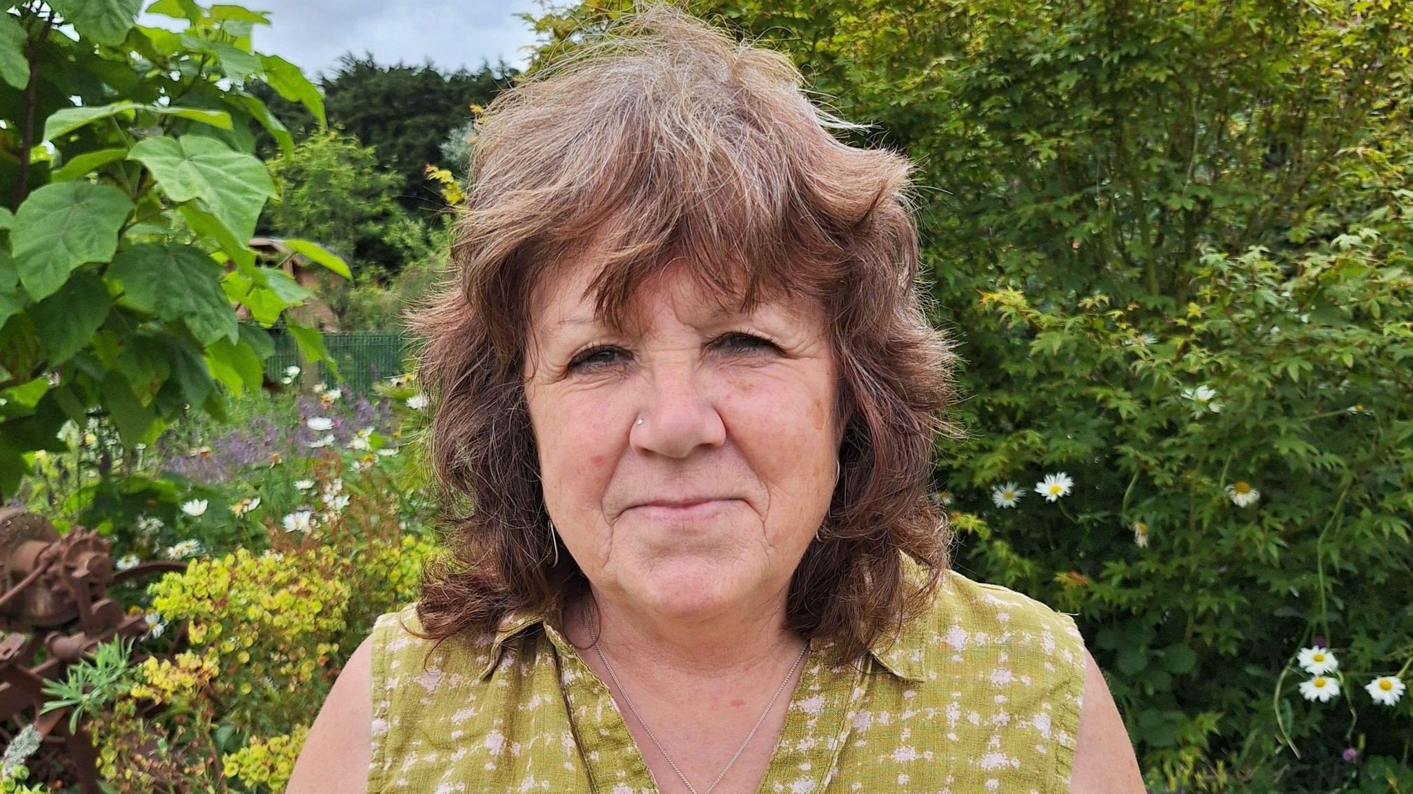 Sherry Morrison stood in a garden