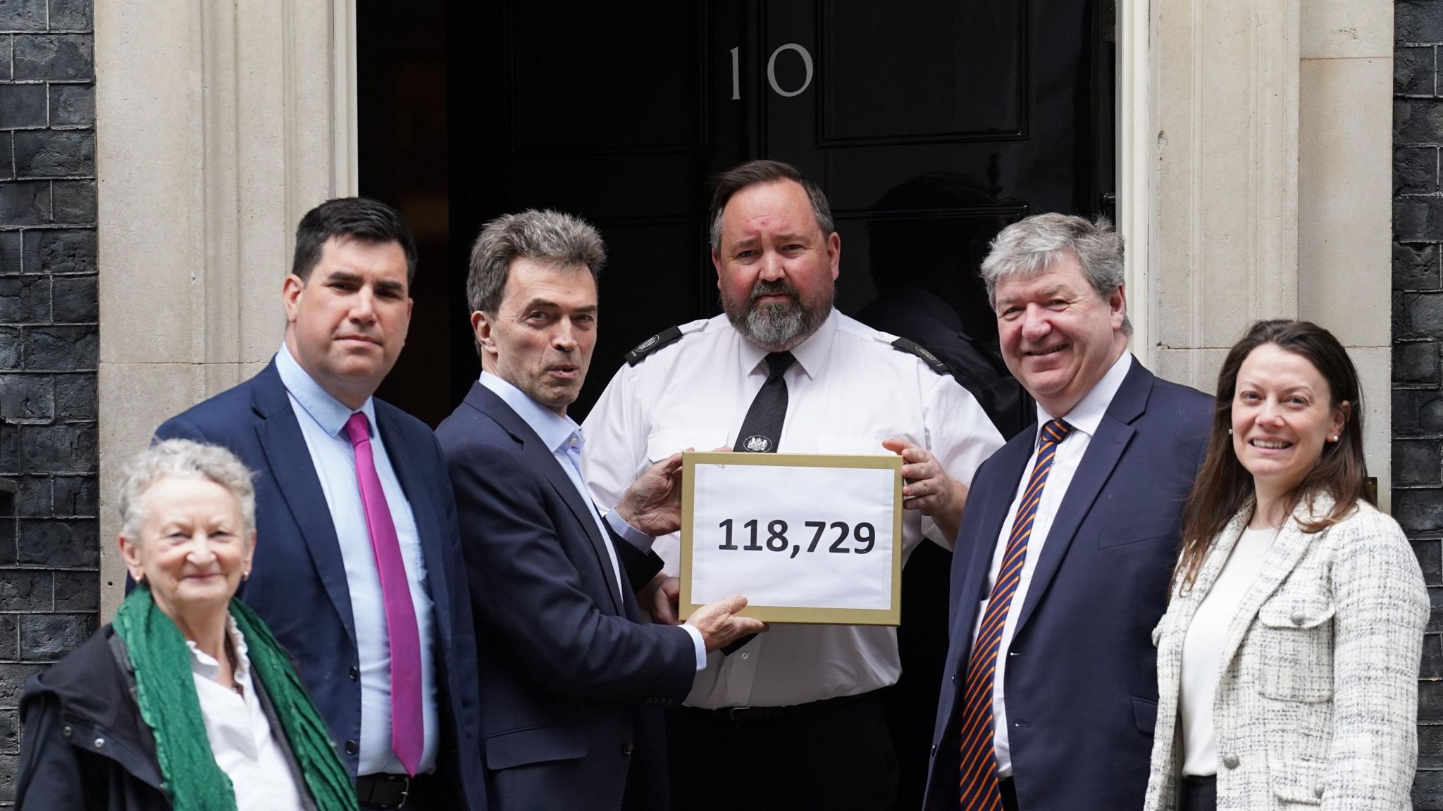 Jenny Jones, Richard Burgon, Tom Brake, Alistair Carmichael and Sarah Green hands in a petition signed by over 100,000 people to 10 Downing Street