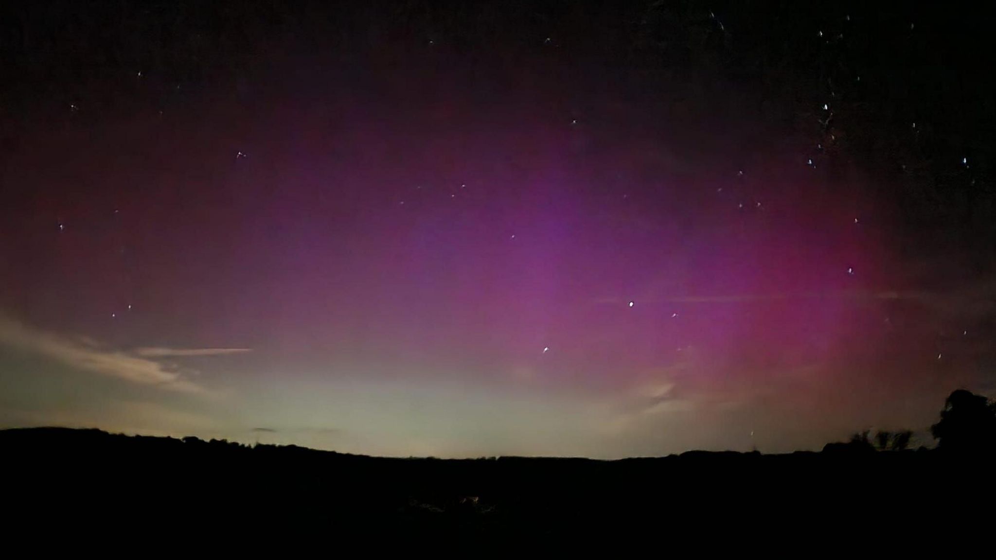 Purple skies filled with stars over Chedworth in the Cotswolds 