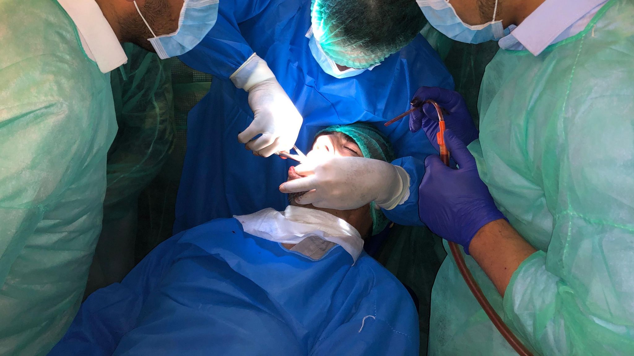 Dentists working on a patient in Afghanistan