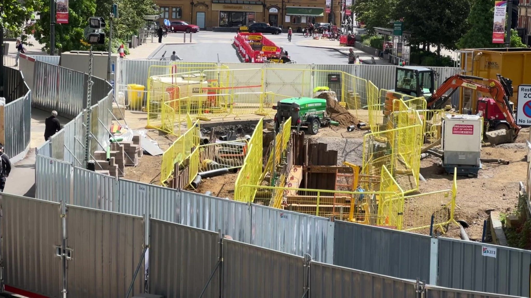 A building site on the botley road in oxford, bisected by pedestrian only paths